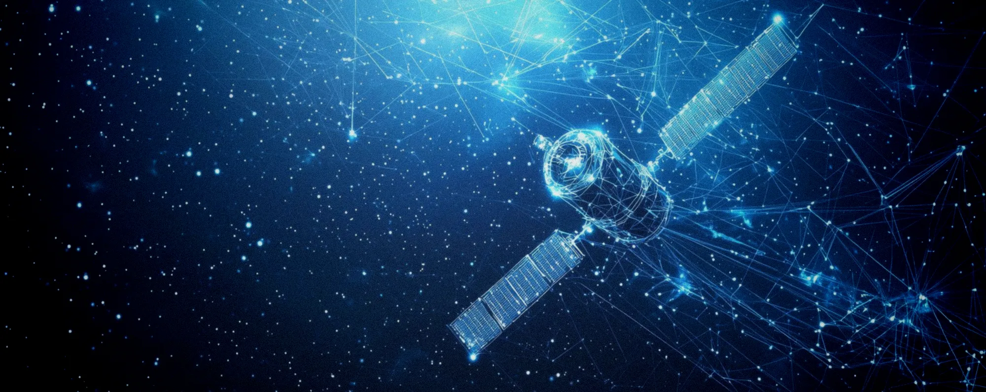 Ingénieur examiant les plans d'un satellite de télécommunications en orbite géostationnaire