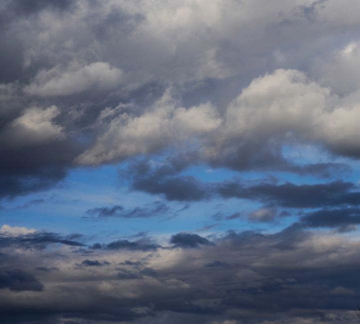 Beautiful dramatic cloud formation with stormy weather and patches of blue sky.