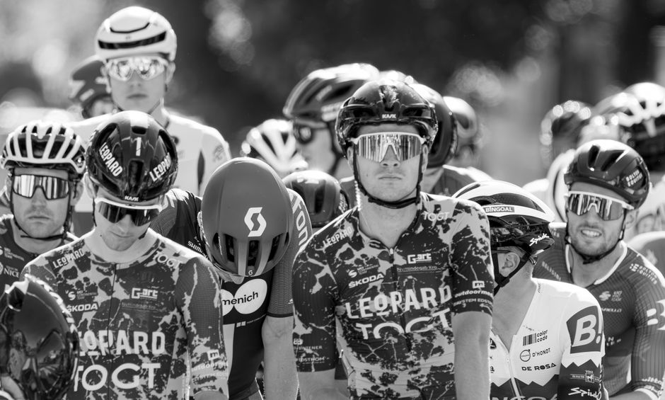 A group of cyclists at the starting line, capturing the spirit of competition.