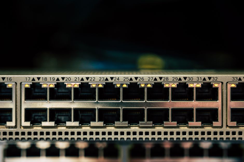 Detailed view of a network switch featuring multiple ethernet ports and LED indicators.