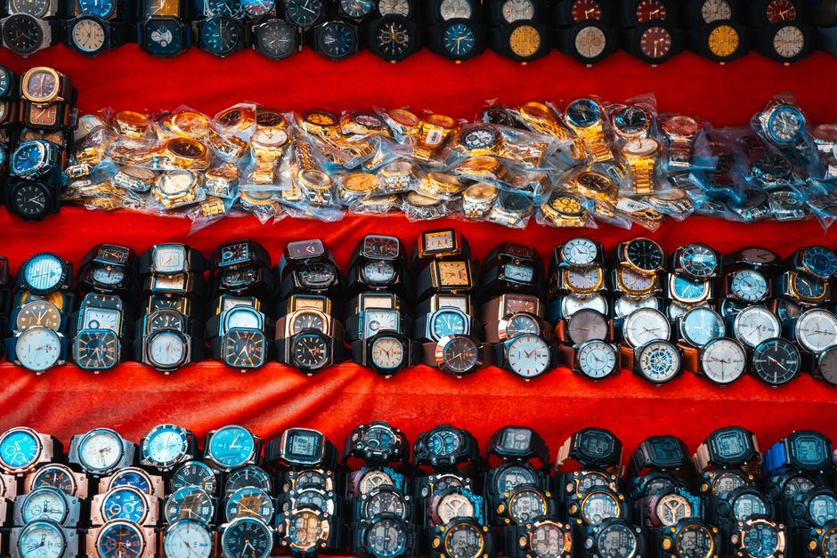 Explore a colorful array of watches showcased in Colombo's bustling Pettah market, Sri Lanka.