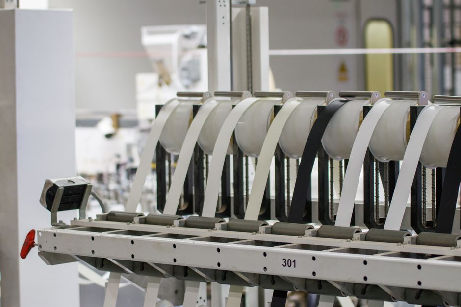 Modern industrial machine in operation in a manufacturing facility showcasing advanced technology.