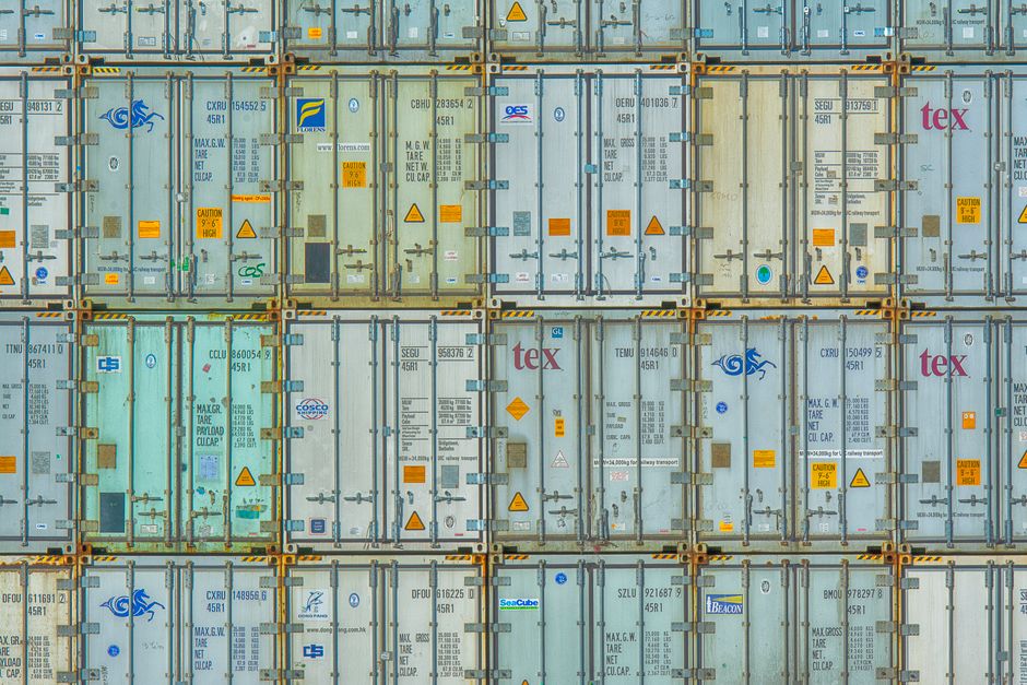 A vibrant display of stacked shipping containers, highlighting industrial organization.